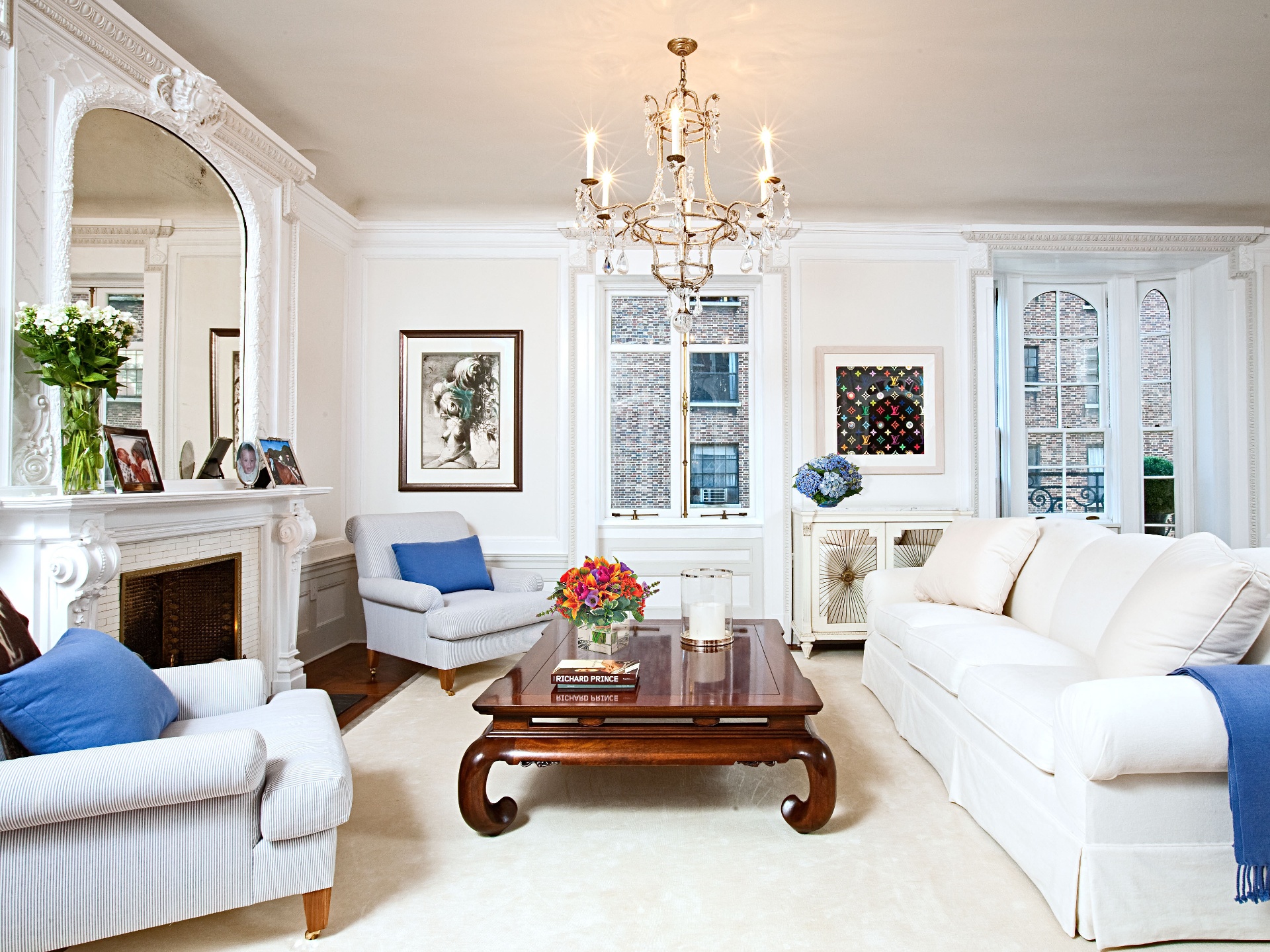 Classic living room with white sofas and chandelier