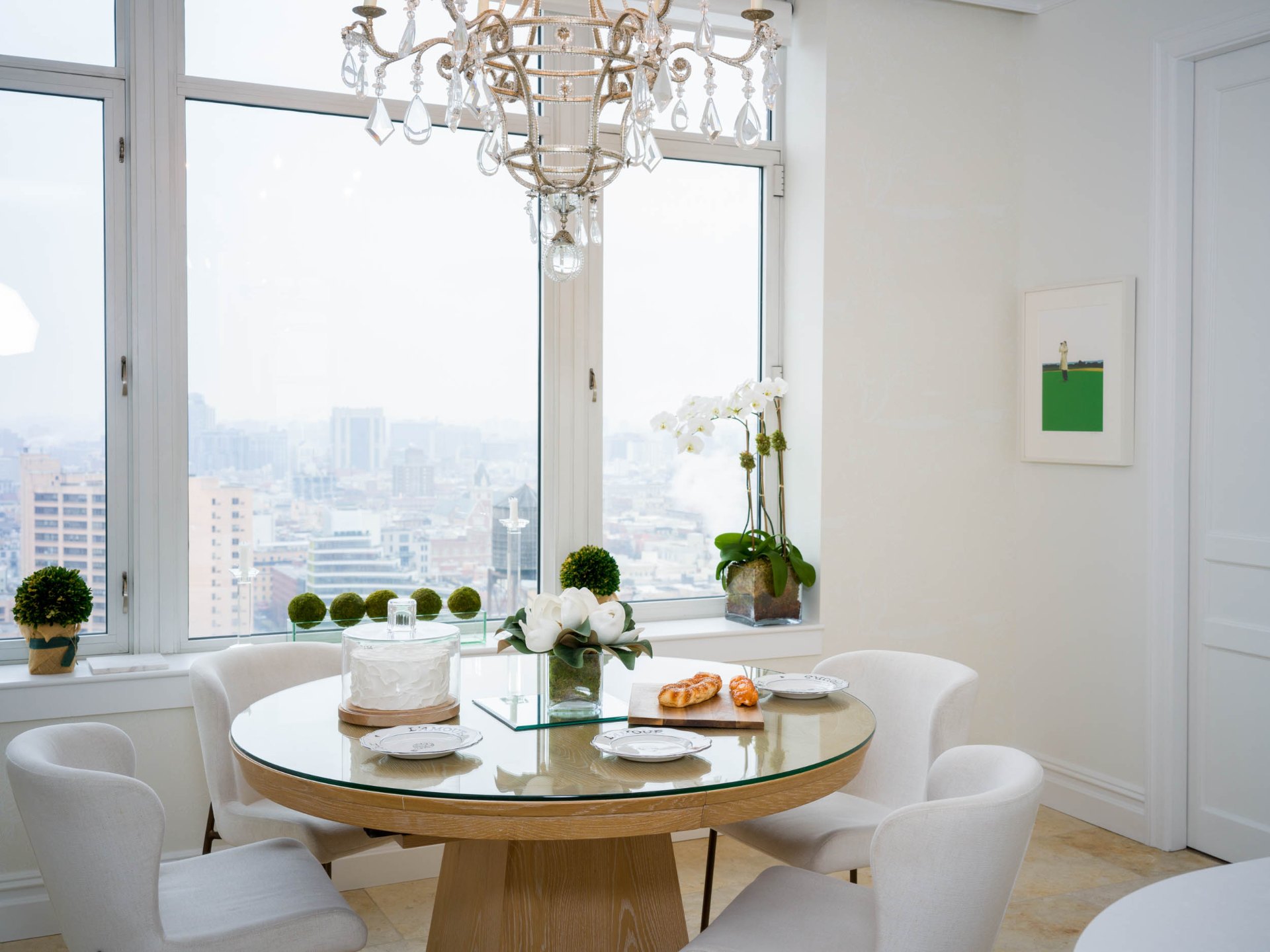 Breakfast nook with crystal chandelier and skyline