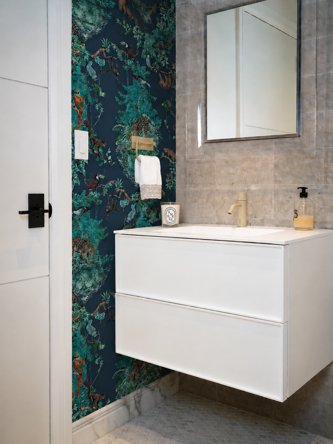 Powder room with jungle wallpaper and floating white vanity